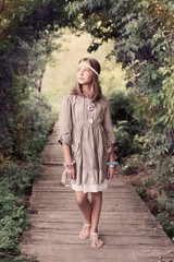 beautiful girl on old wooden brdge in forest