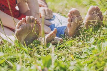 Family, mom, dad and child on the nature of the toe, heel