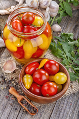 canned and preserved domestic tomato on an old rustic table