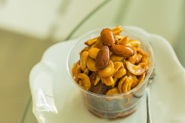 almond and cashews cake in plastic cup