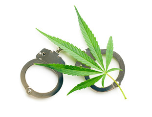 cannabis leaf and handcuffs