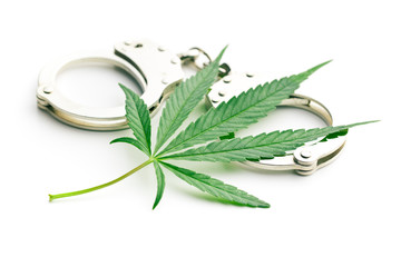 cannabis leaf and handcuffs