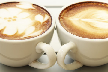Hot mocha coffee decorated on white background, latte art.