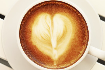 Hot mocha coffee decorated on white background, latte art.