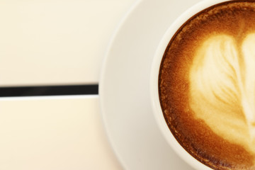 Hot mocha coffee decorated on white background, latte art.