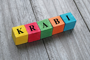 word Krabi (resort in Thailand) on colorful wooden cubes