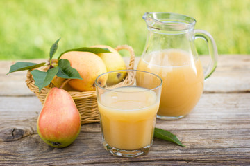 Pear juice in the glass and pitcher
