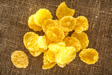 Wooden spoon and corn flakes