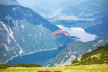 Tuinposter Paragliding at the Dachstein Mountains © aldorado