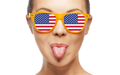 funny teenage girl in shades with american flag