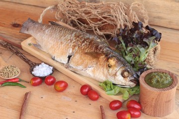 Grilled fish of salt with spicy sauce delicious.