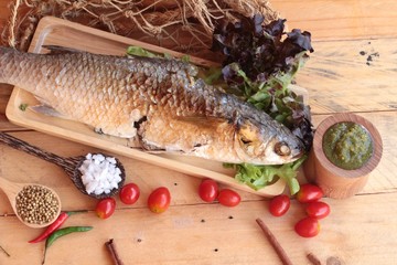 Grilled fish of salt with spicy sauce delicious.