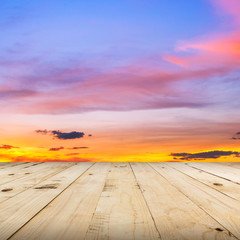 Fototapeta na wymiar wood floor and sky sunset with space