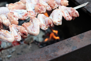 Chicken on the grill to cook