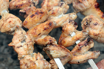 Chicken on the grill to cook