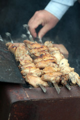 Chicken on the grill to cook