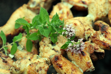 Chicken on the grill to cook