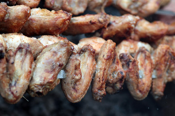 Chicken on the grill to cook