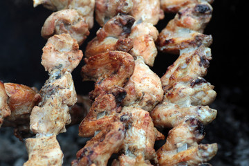 Chicken on the grill to cook