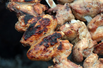 Chicken on the grill to cook