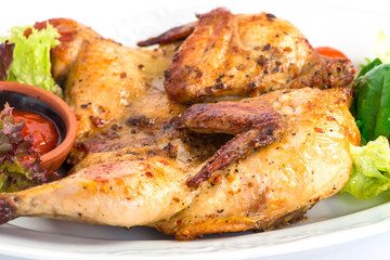 Grilled chicken on the plate with salad