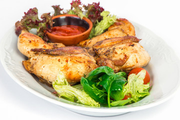 Grilled chicken on the plate with salad