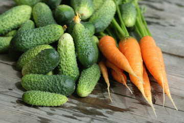 fresh crop of carrots and cucumbers
