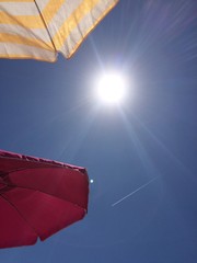 Umbrellas and sun at beach