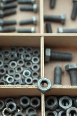 Fototapeta na wymiar screws and bolts in a box