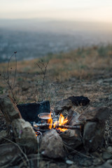 fire with  small pot of food