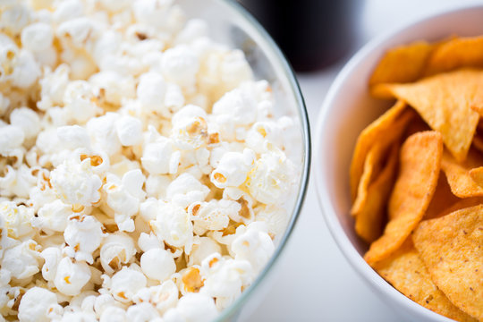 Close Up Of Popcorn And Corn Crisps Or Nachos