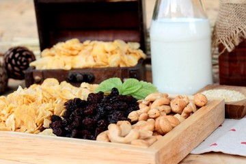 Corn flake with currant dried fruit ,cashew nuts and milk.