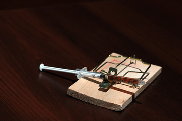 Drugs in a mousetrap cant dose syringe