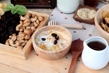 Corn flake with currant dried fruit ,cashew nuts and milk.