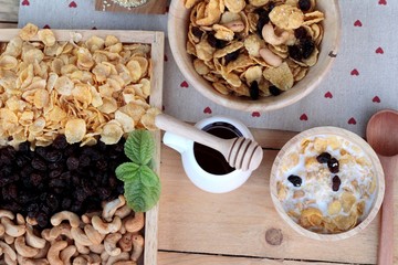Corn flake with currant dried fruit ,cashew nuts and milk.