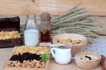 Corn flake with currant dried fruit ,cashew nuts and milk.