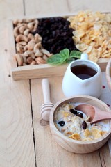 Corn flake with currant dried fruit ,cashew nuts and milk.