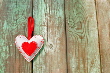 Double hearts on wooden background