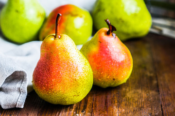 Pears on wooden background