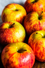Colorful apples on wooden background