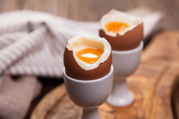 Boiled eggs on a wooden background
