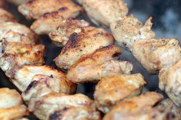 Chicken on the grill to cook