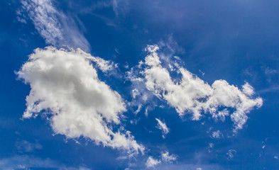 Sky background with the fluffy white clouds