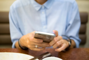 Typing on a smart phone, selective focus