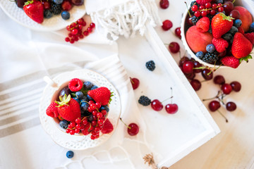 Mix of fresh berries in a cup of tea