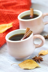 Two cups of coffee in autumn