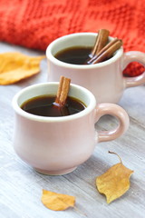 Two cups of coffee in autumn