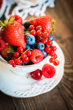 Mix of fresh berries in a cup of tea