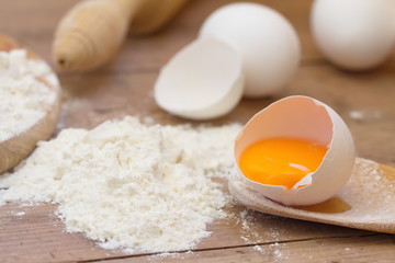 Fototapeta na wymiar Dough preparation. Baking ingredients: egg and flour.