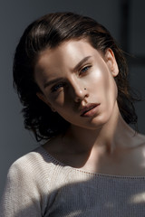 Portrait of a beautiful young woman in studio